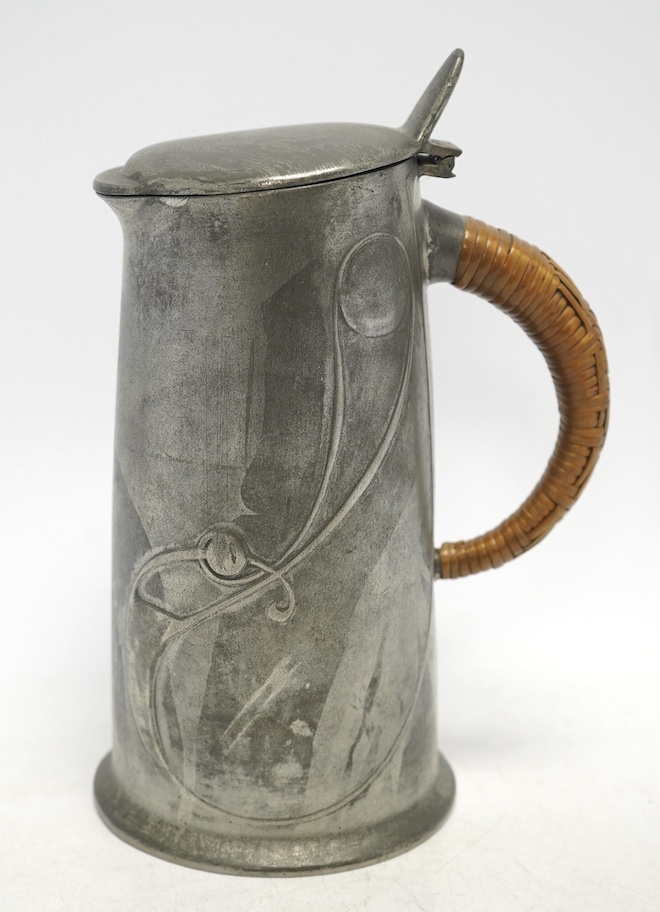 Archibald Knox, an Arts & Crafts Tudric pewter jug, with wicker handle, numbered 0305, 21cm high. Condition - good